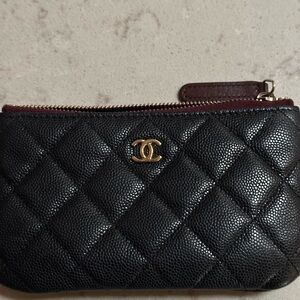 Black quilted zip wallet